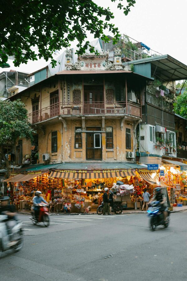 Old colonial-era buildings along a street in Hanoi Old Quarter