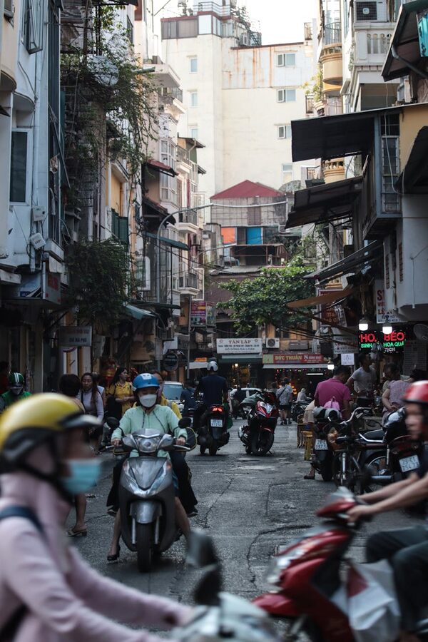 Scooters and pedestrians in Hanoi Old Quarter