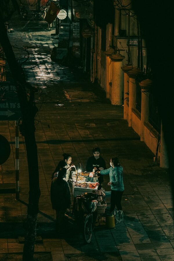 Street food vendor cooking at night in Hanoi