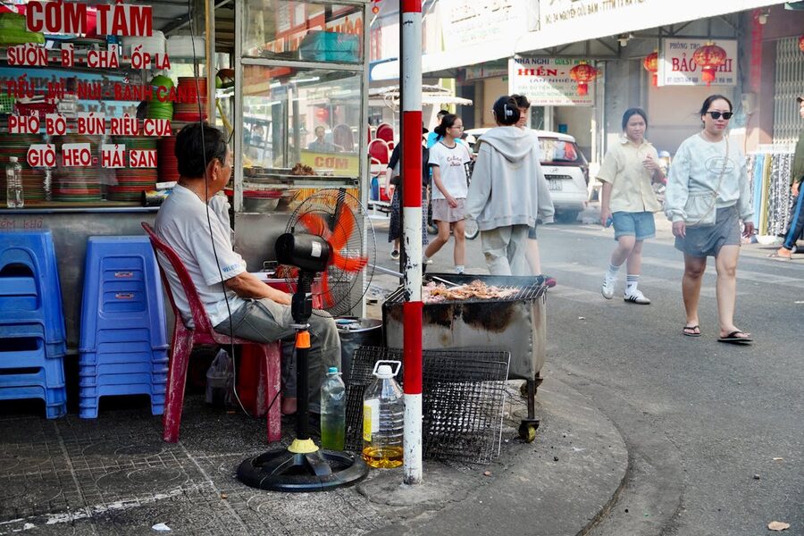 Grilling food vendor on a Ho Chi Minh City street