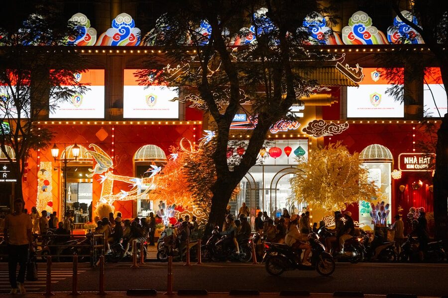 Ho Chi Minh City nightlife street scene with neon lights and crowds