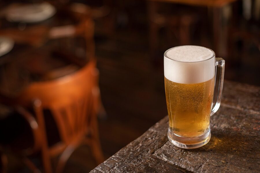 Fresh Heineken pour at a bar