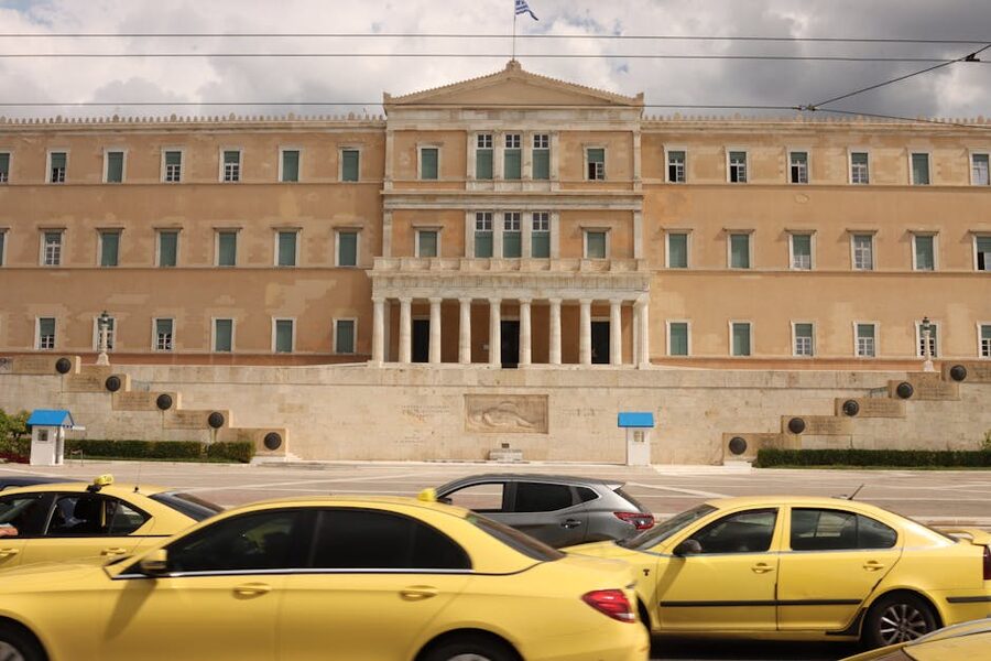 Hellenic Parliament Athens with yellow taxis