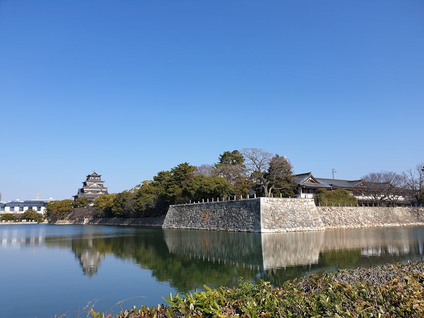 Hiroshima Castle reflected in the surrounding moat