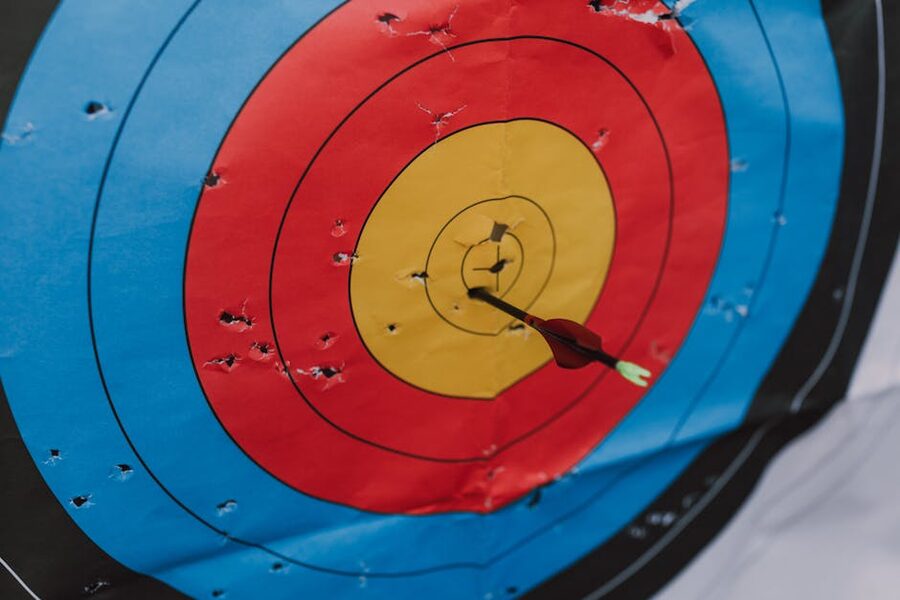 Arrow in bullseye of archery target