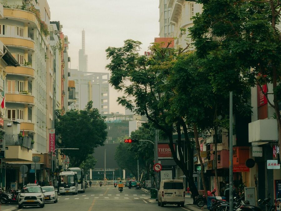 Street scene in Ho Chi Minh City with motorbikes and urban architecture