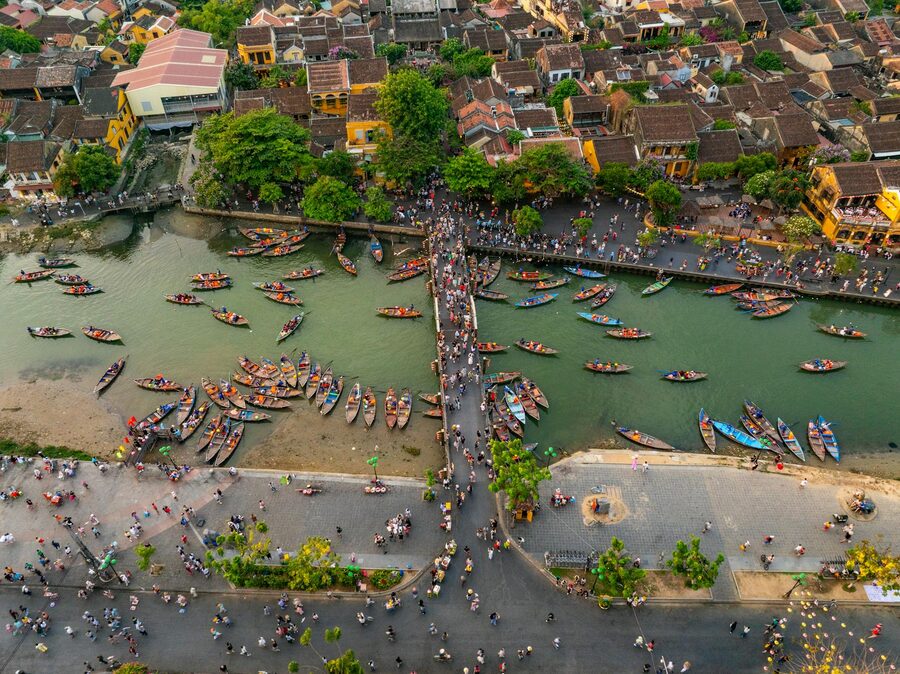 Aerial view of Hoi An waterfront with boats at night