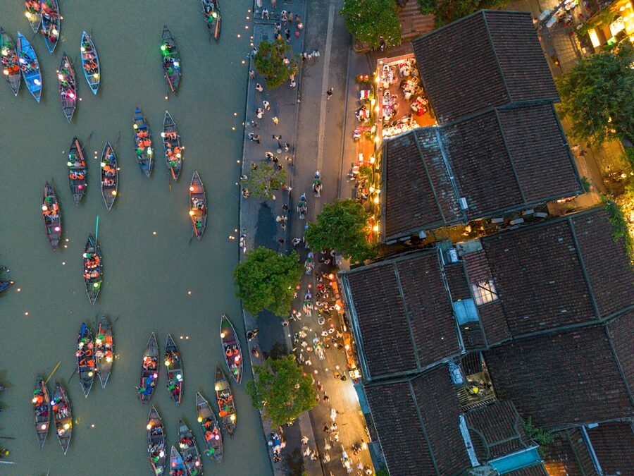 Aerial view of the Thu Bon River and Hoi An old town lit up with lanterns at night