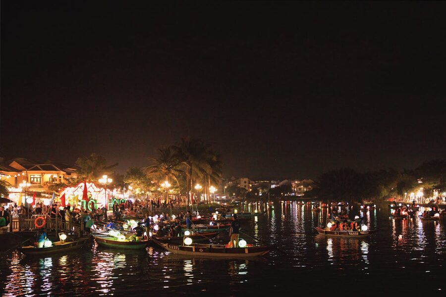 Night festivities at Hoi An ancient town riverside with lanterns and lights