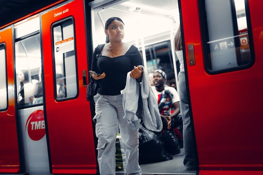 Red TMB metro train Barcelona platform