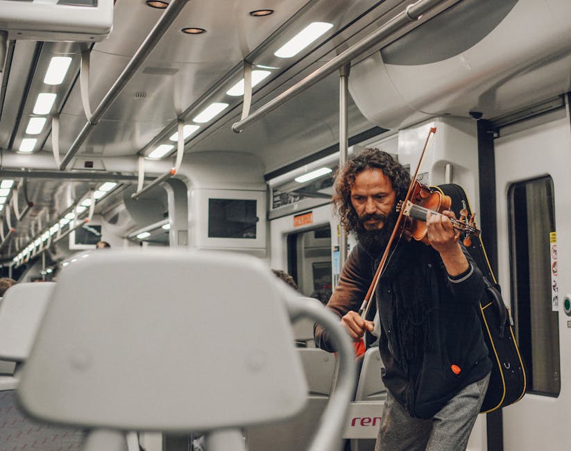 Violinist playing inside a Barcelona metro train