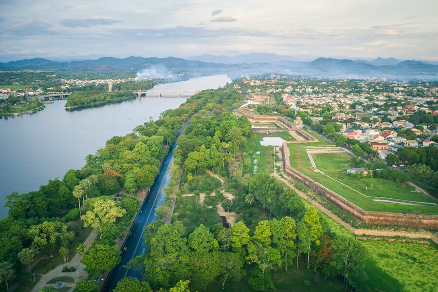 Aerial view showing Hue city with lush greenery and the Perfume River