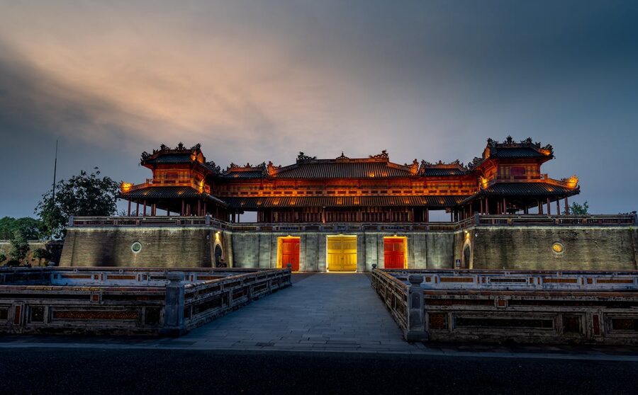 Hue Imperial City buildings lit up at dusk