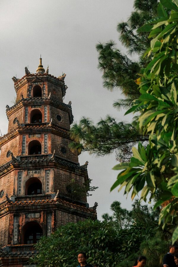 Thien Mu Pagoda surrounded by green trees in Hue