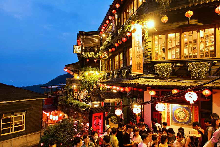 Jiufen Old Street at night with lanterns and crowds