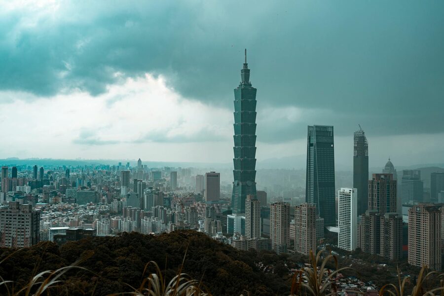 Taipei 101 and city skyline under dramatic clouds