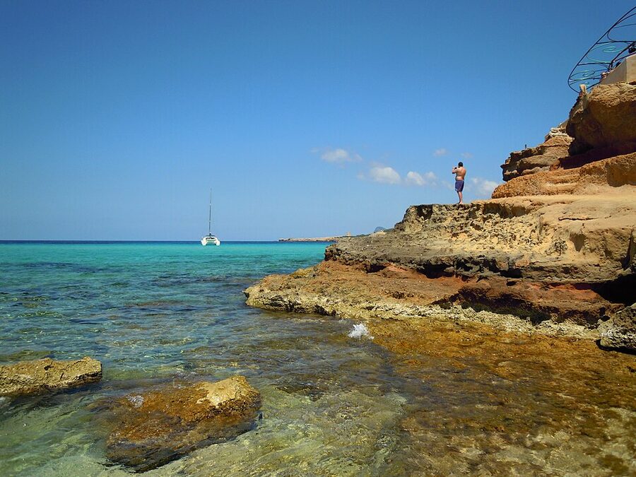 Cala Conta Ibiza turquoise water with offshore islets