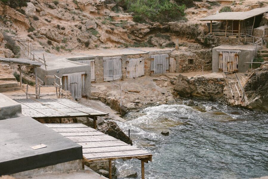 Rustic fishermen's huts on rocky Ibiza coastline