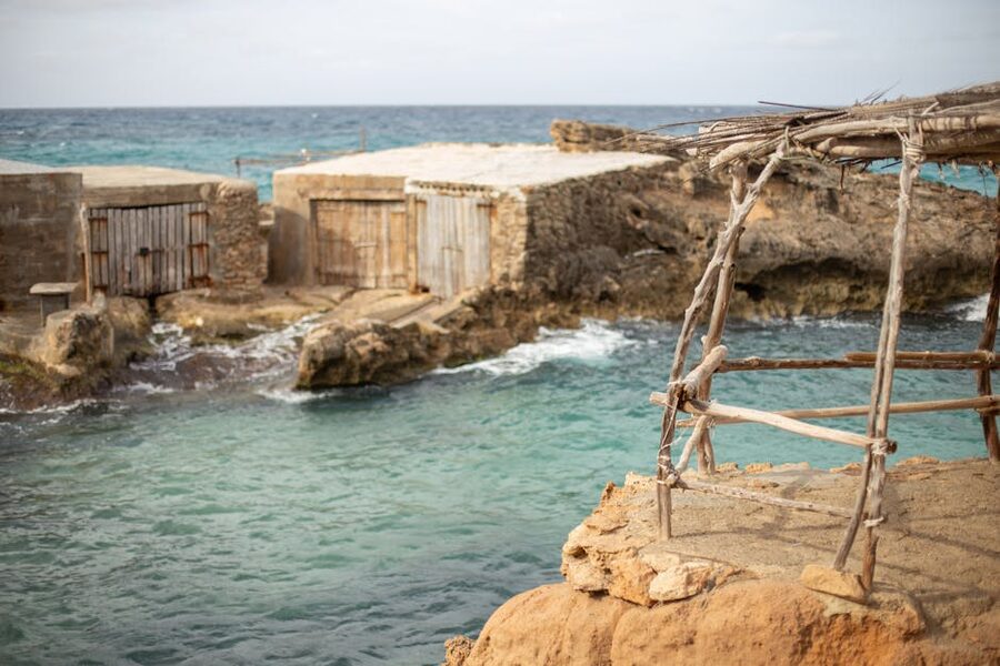 Rocky western coastline of Ibiza with turquoise water