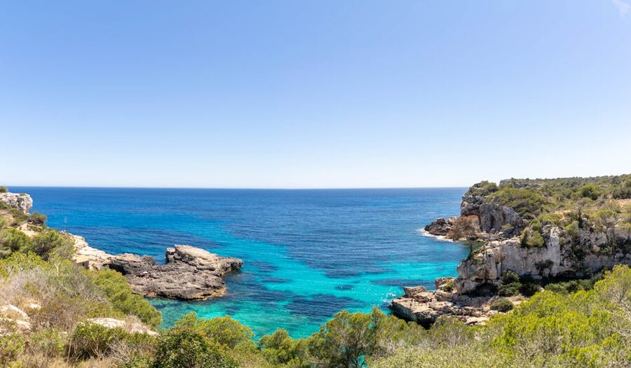 Sant Antoni de Portmany turquoise sea and cliffs Ibiza