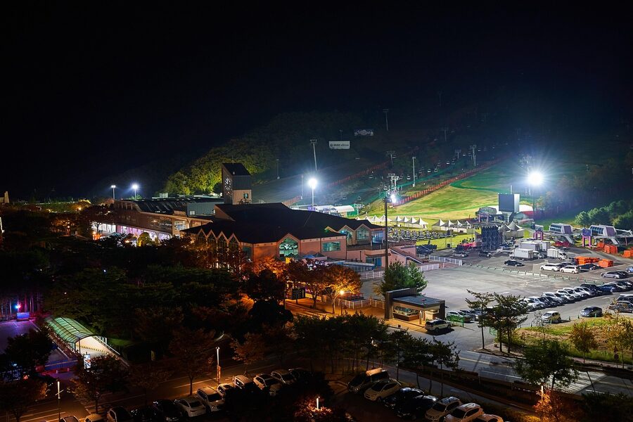 Korean ski resort illuminated at night with light trails on the slopes