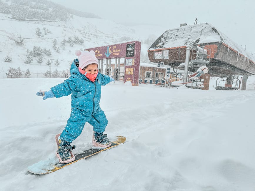 Young child snowboarding at a Korean ski resort