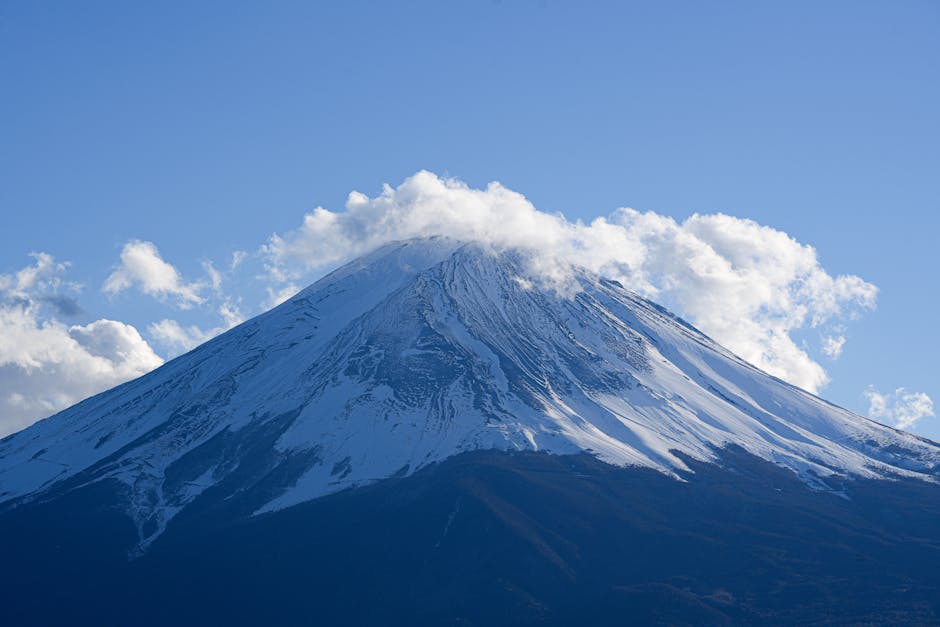 Mount Fuji with snow-covered peak against a clear blue sky