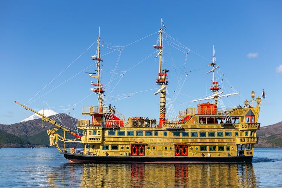 Colourful pirate ship sailing on Lake Ashi with snow-capped Mount Fuji in the background