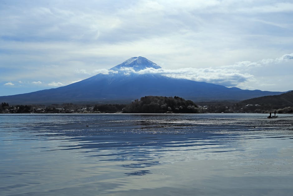 Mount Fuji reflected in the calm waters of Lake Kawaguchiko