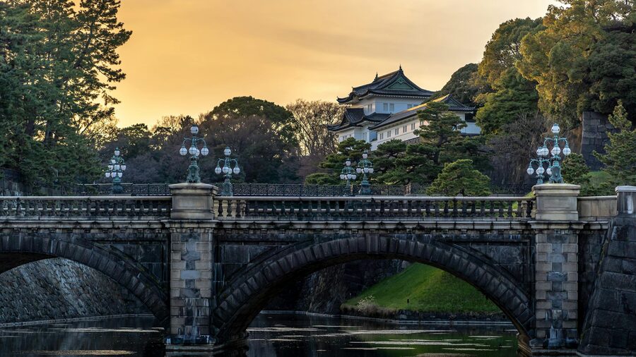 Imperial Palace in Tokyo with its famous stone bridge photographed at sunset