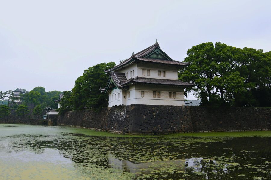 Historic stone walls and moat surrounding the Imperial Palace in Tokyo