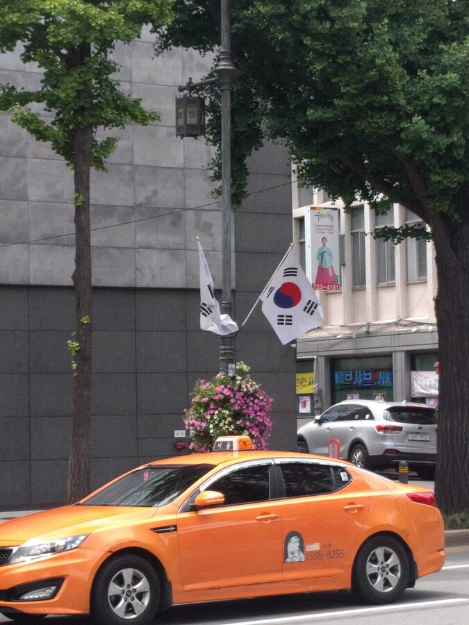 Korean sedan taxi on a city street