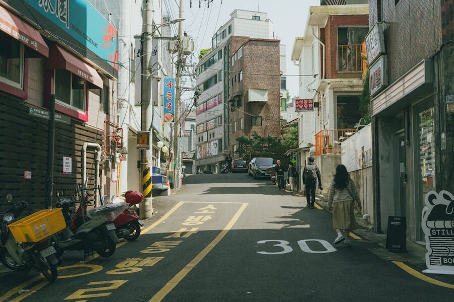 Quiet Seoul neighbourhood street with traditional storefronts