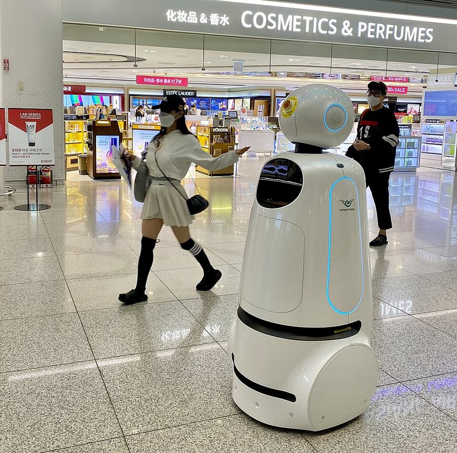 Incheon airport terminal interior with travellers walking through