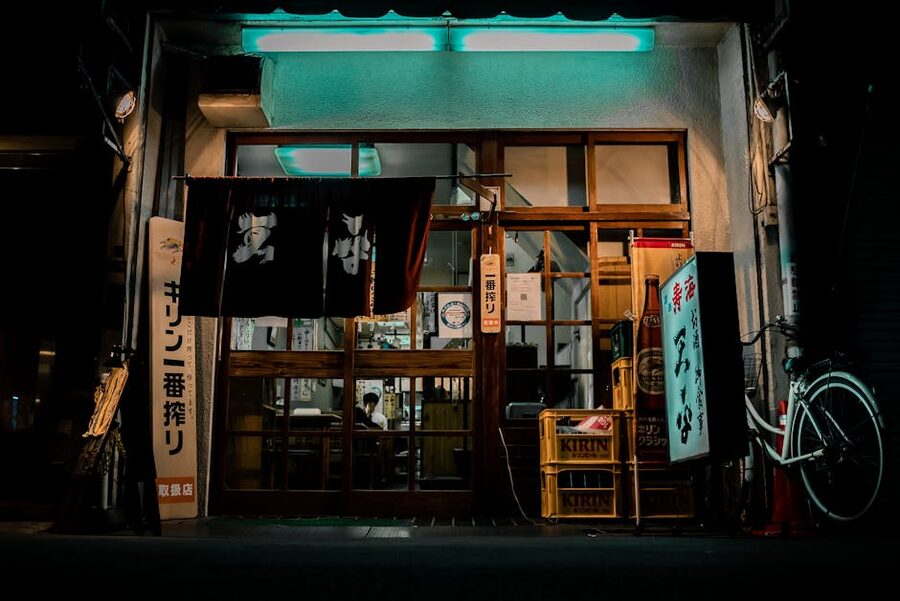 Traditional izakaya facade with neon signs