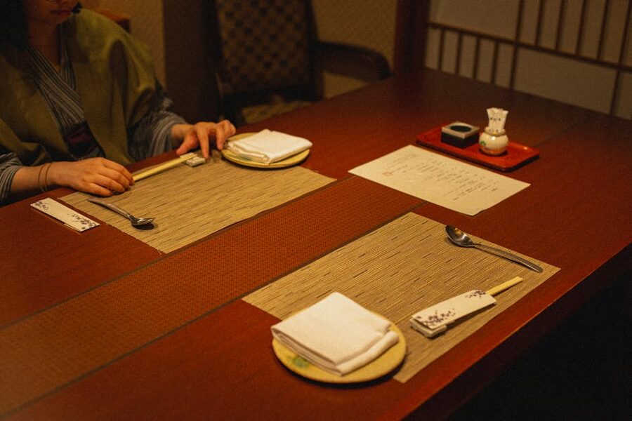 Traditional Japanese dining table setup with lacquerware and chopsticks