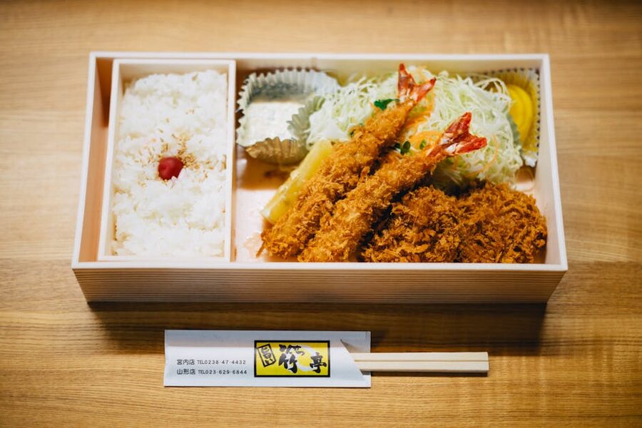 Japanese bento lunch box with rice prawn and salad