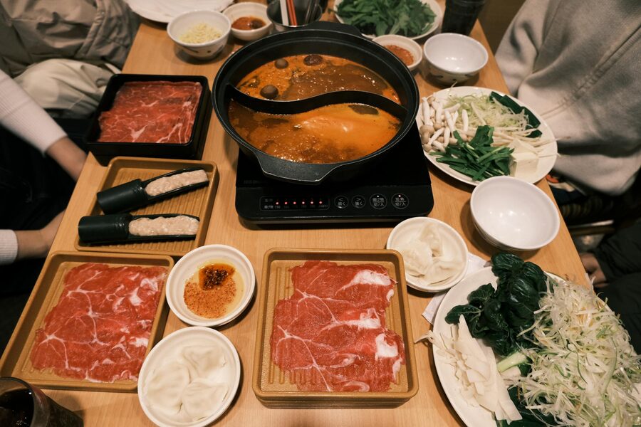 Traditional Japanese sukiyaki hotpot with fresh vegetables and meat