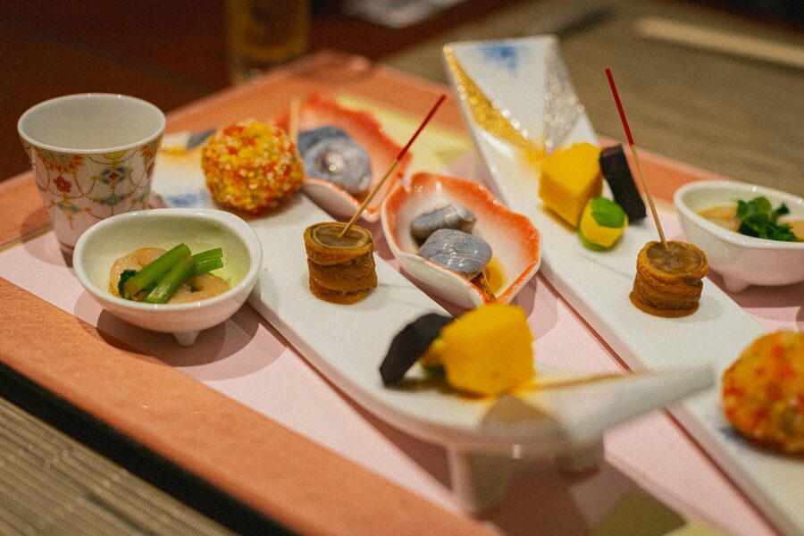 Exquisite Japanese kaiseki cuisine dishes artfully presented on traditional plates