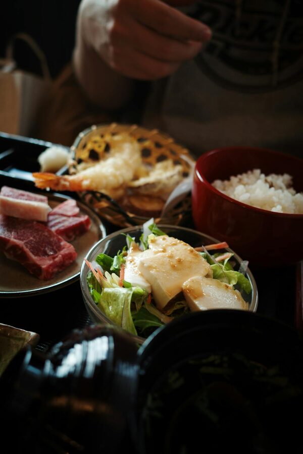 Authentic Japanese meal with tempura, rice, and fresh vegetables