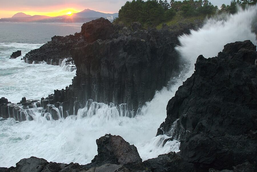 Waves crashing against Jusangjeolli Jungmun columnar joints Jeju