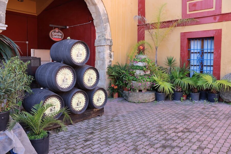 Sherry bodega courtyard with stacked oak barrels in Andalusia