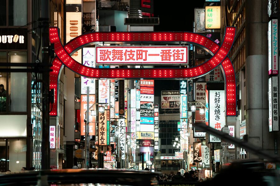 Bright neon signs illuminating the streets of Kabukicho entertainment district