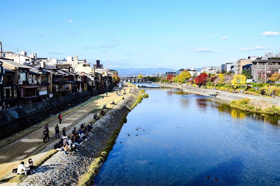 Kamo River and Kyoto cityscape with autumn foliage