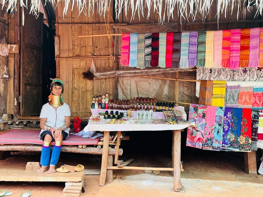 Karen woman in traditional dress at a textile market in Chiang Rai Thailand