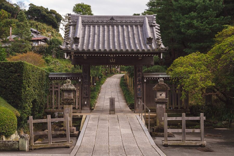 Serene pathway leading to a traditional Japanese gate at Kencho-Ji Temple Kamakura