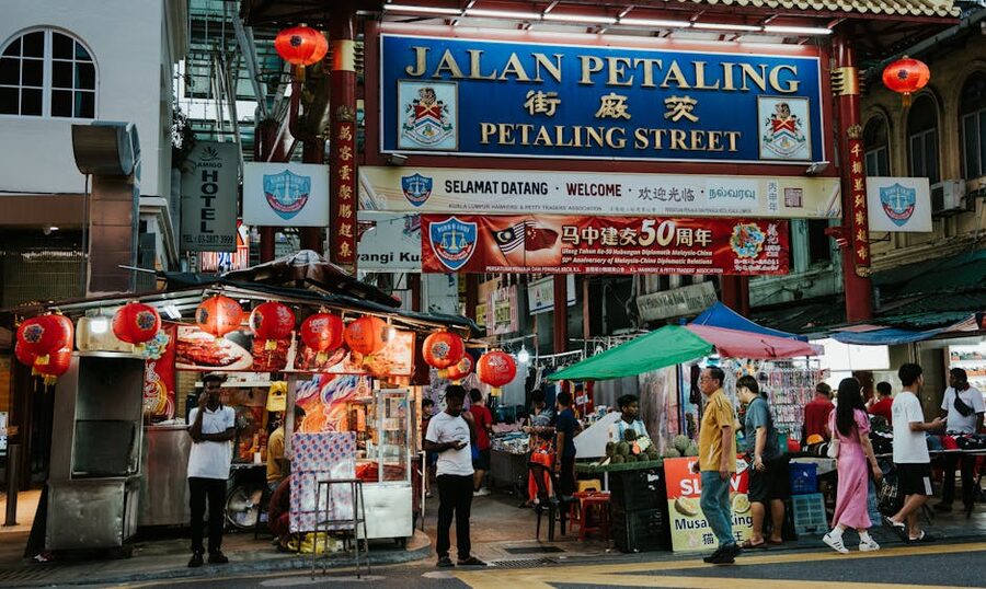 busy scene at Petaling Street in Kuala Lumpur featuring lanterns and food vendors