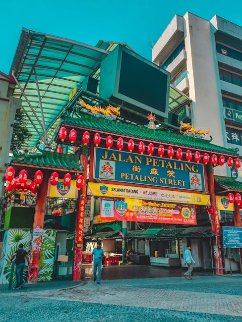 lively view of Petaling Street entrance in Kuala Lumpur featuring traditional red lanterns