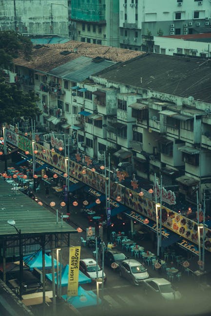 lively urban market scene in Kuala Lumpur Malaysia with food vendors and shoppers