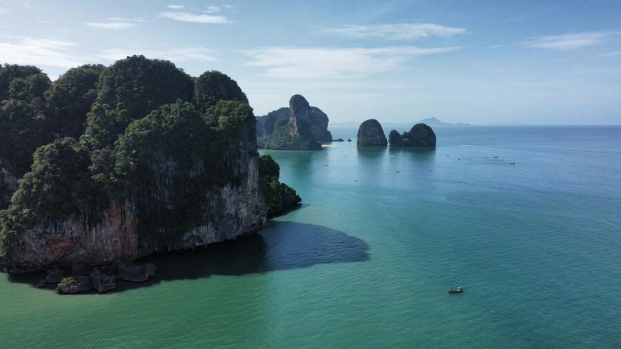 Aerial view of limestone islands in turquoise Thai waters